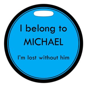 May include: A round blue tag with a black border and a black hole at the top. The tag says "I belong to MICHAEL I'm lost without him".