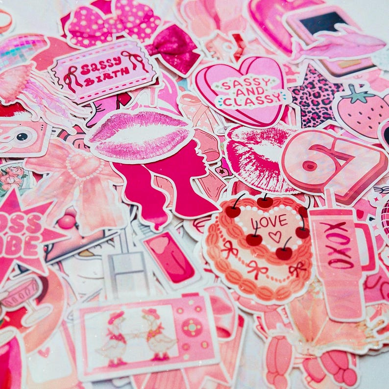 May include: A collection of pink stickers with various designs, including lips, bows, a cake with cherries, and the text "Sassy Birth" and "Sassy and Classy". The stickers are in shades of pink and white.