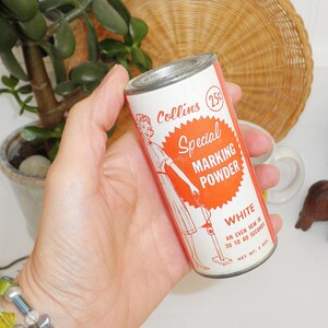 May include: A vintage metal can of Collins Special Marking Powder in white. The can features a red and white label with a woman holding a measuring tape and the text "Collins Special Marking Powder White An Even Hem in 30 to 60 Seconds Net Wt. 4 oz."
