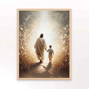 May include: A framed art print depicts a figure in a white robe walking with a child along a path. The artwork has a soft, warm color palette with a bright light in the background, suggesting a spiritual theme.
