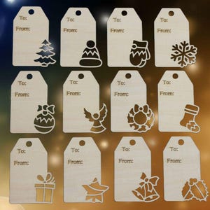 May include: A collection of twelve wooden gift tags with laser-cut Christmas-themed designs. Each tag has a hole at the top and the words "To:" and "From:" etched on the surface. Designs include a Christmas tree, snowflake, and gift box.