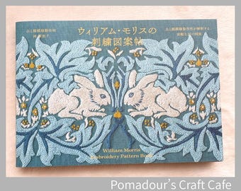 May include: A teal-colored book cover featuring an embroidered design with two white rabbits facing each other. The design includes light blue leaves and yellow accents. The text "William Morris Embroidery Pattern Book" is visible.