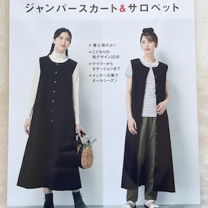 May include: A sewing pattern for a black jumper skirt and a black sleeveless top. The pattern includes instructions for sizes S, M, and L. The text on the pattern reads "1 year round wear, jumper skirt & overalls".