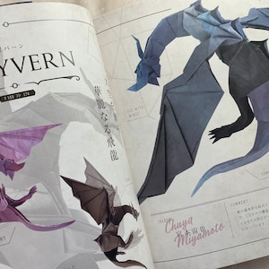 May include: A book page with a blue origami wyvern with a long tail and wings. The text on the page reads "Fly with Wises" and "Long Tail". The creator is listed as "Chuya Miyamoto".