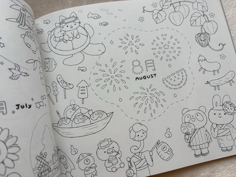 May include: A black and white illustration of a colouring book page featuring summer-themed drawings. The page includes drawings of a cat in a life preserver on a turtle, fireworks, and the text "August". Other drawings include food and cartoon characters.