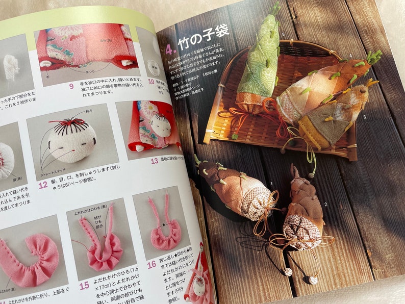 May include: A book with instructions on how to make a traditional Japanese doll and bamboo shoot ornaments. The book is open to a page showing a close-up of the doll and a page showing the bamboo shoot ornaments.