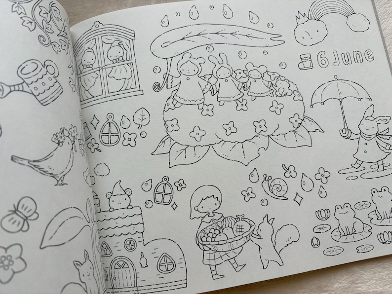 May include: Black and white line art illustration from a colouring book. The image features various whimsical scenes, including a girl with a basket, animals, and the text "6 June". Other elements include a rainbow, rain, and a bunny with an umbrella.