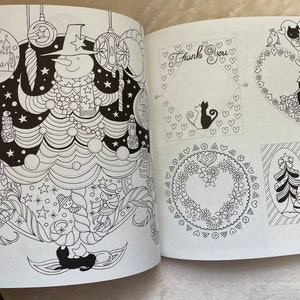 May include: A black and white coloring book page featuring a snowman in a hat and scarf, surrounded by Christmas ornaments and a Christmas tree. The page also includes several other designs, including a heart-shaped wreath, a Christmas card with a tree, and a thank you card with a cat.