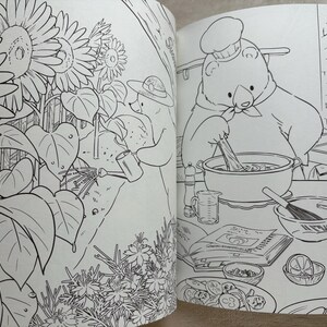 May include: Black and white illustration from a coloring book. One page shows a bear watering sunflowers, the other shows a bear chef cooking. The chef is stirring a pot, surrounded by ingredients.