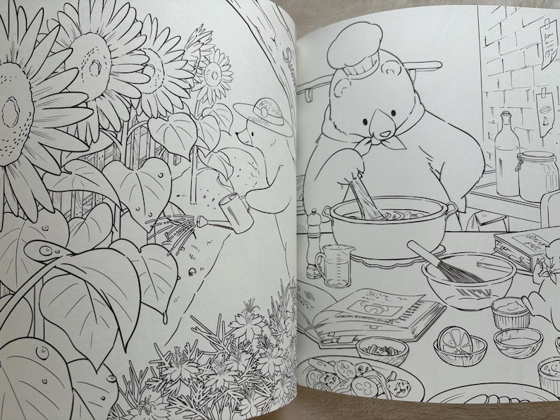 May include: Black and white illustration from a coloring book. One page shows a bear watering sunflowers, the other shows a bear chef cooking. The chef is stirring a pot, surrounded by ingredients.