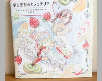 May include: A coloring book titled "Dream and Fantasy Cafeteria" featuring a detailed illustration of a girl surrounded by fruit and desserts. The cover art includes Japanese text and is set against a light background with a striped border.