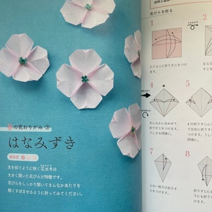 May include: A step-by-step origami guide for making a pink paper flower, called a "habanero", with instructions in Japanese. The instructions include diagrams showing how to fold the paper to create the flower.
