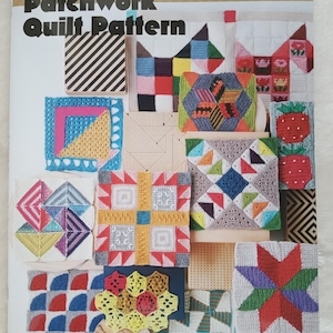May include: A book cover displaying a variety of colourful crochet quilt squares, with the title "Crochet Patchwork Quilt Pattern" in English and Japanese. The squares showcase geometric and floral patterns in red, blue, green, and yellow.
