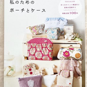 May include: A book titled "Pomadour's Craft Book" with a cover image of various fabric pouches and bags. The book features 100 different designs for pouches and cases.