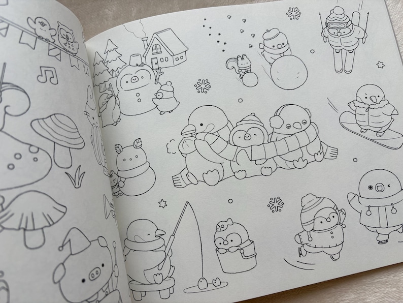 May include: A colouring book page with winter-themed illustrations. The drawings include penguins, snowmen, and other cute characters engaged in winter activities like skiing, snowboarding, and ice skating. The images are outlined in black on a white background.