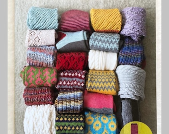 May include: A book cover displaying a variety of hand-knitted socks in different colours and patterns. The text on the cover reads "Colorful, Cute! Easy Hand-Knitted Socks." The book is titled "POMADOUR'S CRAFT."