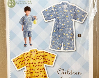 May include: A sewing pattern for a children's jinbei, a traditional Japanese summer garment. The pattern includes two designs: one with a blue and yellow wave pattern and the other with a yellow and red apple pattern. The pattern is for children ages 88 to 116 cm tall.