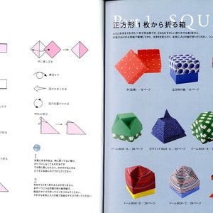 May include: A book with instructions on how to fold origami boxes from a single square piece of paper. The book features colorful illustrations of the finished origami boxes, including a red and white striped box, a blue and white patterned box, and a green and white checkered box.