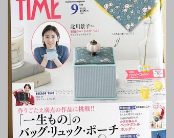 May include: The September issue of Cotton Time magazine features a square fabric box with a floral lid and striped base, topped with a ceramic knob. The cover displays various craft projects, including a tote bag, bottle holder, and skirt, with Japanese text throughout.