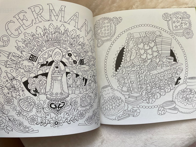 May include: A black and white coloring book page with a detailed illustration of a gingerbread house and a girl in a hooded cloak. The page is titled "GERMAN".