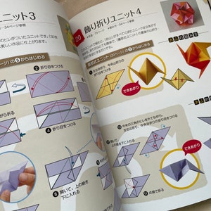 May include: A book with instructions on how to fold origami units. The book is open to a page showing the steps for folding a unit called "Folding Unit 3". The steps are illustrated with diagrams and arrows. The book also shows the finished origami unit.