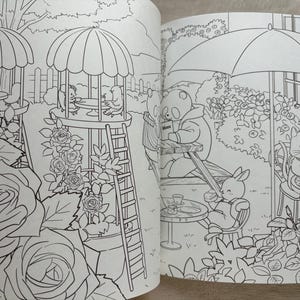 May include: A detailed black and white illustration from a coloring book, depicting a garden scene with anthropomorphic animals. Features include a gazebo, roses, and animals enjoying tea and reading.