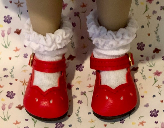 red dress cream shoes