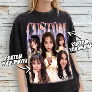 May include: Black oversized t-shirt with a vintage-style graphic featuring a collage of women's faces. The text "CUSTOM" is printed in a bold, colourful font. The shirt also has the text "CUSTOM YOUR PHOTO" and "CUSTOM YOUR NAME" printed on it.