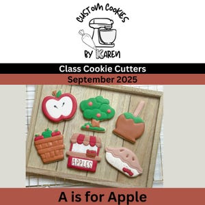 May include: A wooden tray holds six apple-themed cookies. The cookies include an apple, a tree, a caramel apple, a basket of apples, an apple stand, and an apple pie. The cookies are decorated with red, green, brown, and white icing. The text "A is for Apple" is at the bottom.