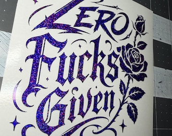 May include: A white decal featuring the text "Zero Fucks Given" in a stylized, gothic-inspired font with a dark purple, glittery holographic finish. To the right of the text is a detailed illustration of a rose with leaves, also in the same purple glitter.