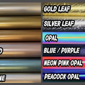 May include: A selection of vinyl rolls in various colors and finishes. The left side features matte finishes in silver, gold, bronze, rose gold, Tiffany, and champagne. The right side displays gold leaf, silver leaf, opal, blue/purple, neon pink opal, and peacock opal.