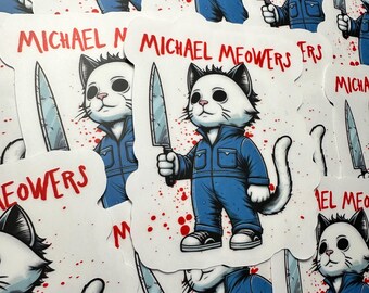 May include: A set of stickers featuring a white cat with black eyes and a black nose wearing a blue jumpsuit and holding a knife. The cat is surrounded by red blood splatters. The stickers have the text "Michael Meowers" in red letters.