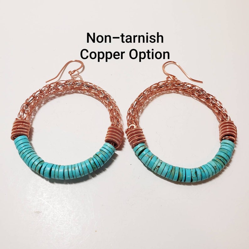 May include: A pair of copper hoop earrings with turquoise beads. The earrings are made of non-tarnish copper and have a woven wire design.  Non-tarnish Copper Option.