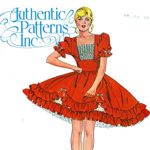 May include: A sewing pattern envelope labeled Authentic Patterns Inc 322 featuring an illustration of a red dress with short puff sleeves, a square neckline with white textured trim, and a full skirt with two tiers of ruffles and small white bows.