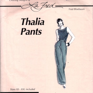 May include: A vintage sewing pattern titled "Thalia Pants" by La Fred. The pattern features a sketch of the pants and top, with the text "Sizes XS - XXL included." The design is described as "Elegant, classic clothing with a contemporary twist."
