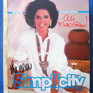 May include: A magazine cover featuring actress Ali MacGraw. The cover is blue and white with the text "The New Simplicity" and "May".