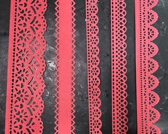 May include: Four red paper lace strips with intricate cut-out designs. The strips vary in width and pattern, including floral and geometric motifs. The edges are scalloped or have decorative cutouts, suitable for crafting or embellishment.