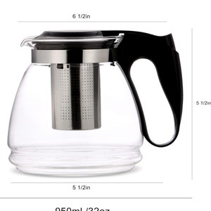 May include: A clear glass teapot with a black handle and lid. The teapot has a stainless steel infuser and a capacity of 32 ounces or 950 milliliters.