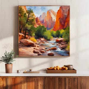 May include: A framed landscape painting depicts a river winding through a canyon. The artwork features vibrant colors, with orange and red rock formations, green trees, and a blue sky. The painting is displayed above a wooden surface.