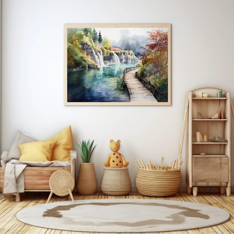 May include: A framed watercolor painting depicts a scenic waterfall cascading into a turquoise lake. A wooden walkway extends along the water's edge, surrounded by lush greenery and autumn foliage. The artwork is displayed above a wooden bed and decorative items.