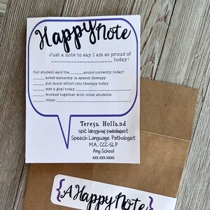 May include: A white Happy Note card with a purple speech bubble design. The card includes fill-in-the-blank prompts and the text "Happy Note" in cursive. A brown envelope is partially visible.