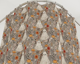 May include: A gray shower curtain featuring a repeating pattern of friendly white ghosts, orange pumpkins, and various flowers. The design has a whimsical, autumnal theme, perfect for Halloween or fall decor.