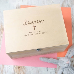 May include: A wooden keepsake box with a personalized inscription. The inscription reads "Lauren" with a cross and "Baptised on 22nd September 2017".