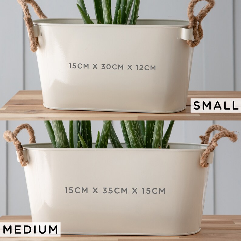 May include: Two white metal planters with rope handles, one labeled "SMALL" with dimensions 15cm x 30cm x 12cm and the other labeled "MEDIUM" with dimensions 15cm x 35cm x 15cm.