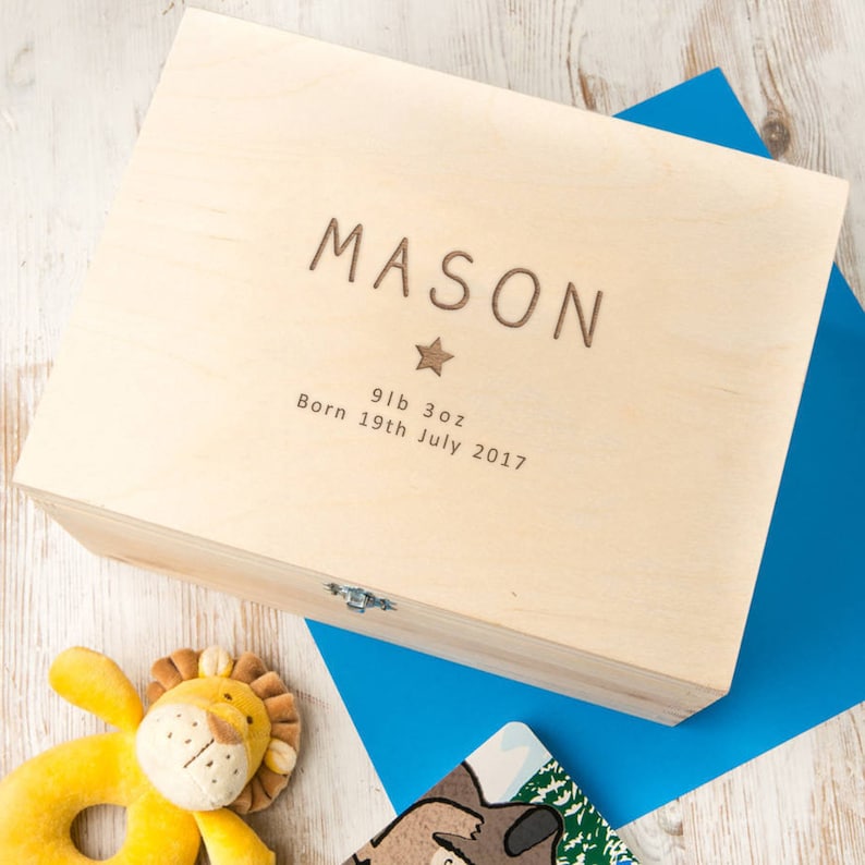 May include: A wooden keepsake box with a hinged lid. The box is engraved with the name "MASON", a star, and the text "9lb 3oz Born 19th July 2017".