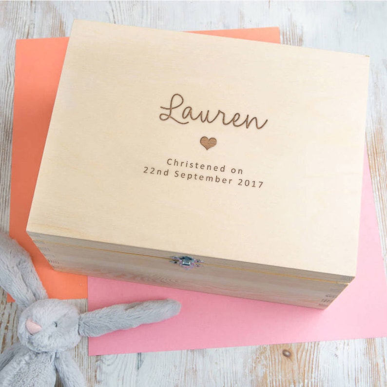 May include: A light wood keepsake box with the name "Lauren" engraved on the lid, along with a small heart and the text "Christened on 22nd September 2017".