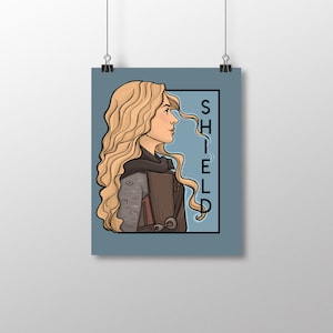 Escudo - Serie She Letra pequeña