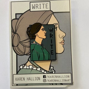 May include: A black and white enamel pin featuring a woman's profile with the word "WRITE" in a black rectangle. The pin is on a card with the text "WRITE" and "KAREN HALLION" with social media handles.