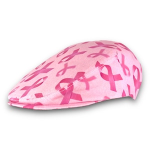 May include: Pink cotton cap with a pattern of pink ribbons.
