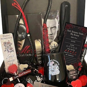 May include: A gift box containing a black leather whip with red accents, a black tumbler with a skull and book graphic, a Dark Romance review card, a bookmark with roses, a pen with red roses, a heart-shaped lollipop, and various small decorative items.